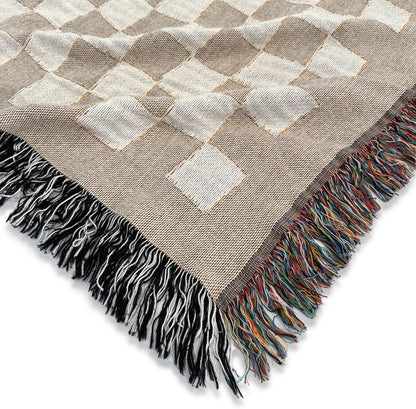 Close product image of beige and white checkered woven throw blanket titled Jolla Checkered.