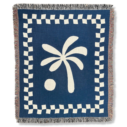 Frontside product image of blue and white palm tree and checker pattern woven throw blanket titled Seaside.