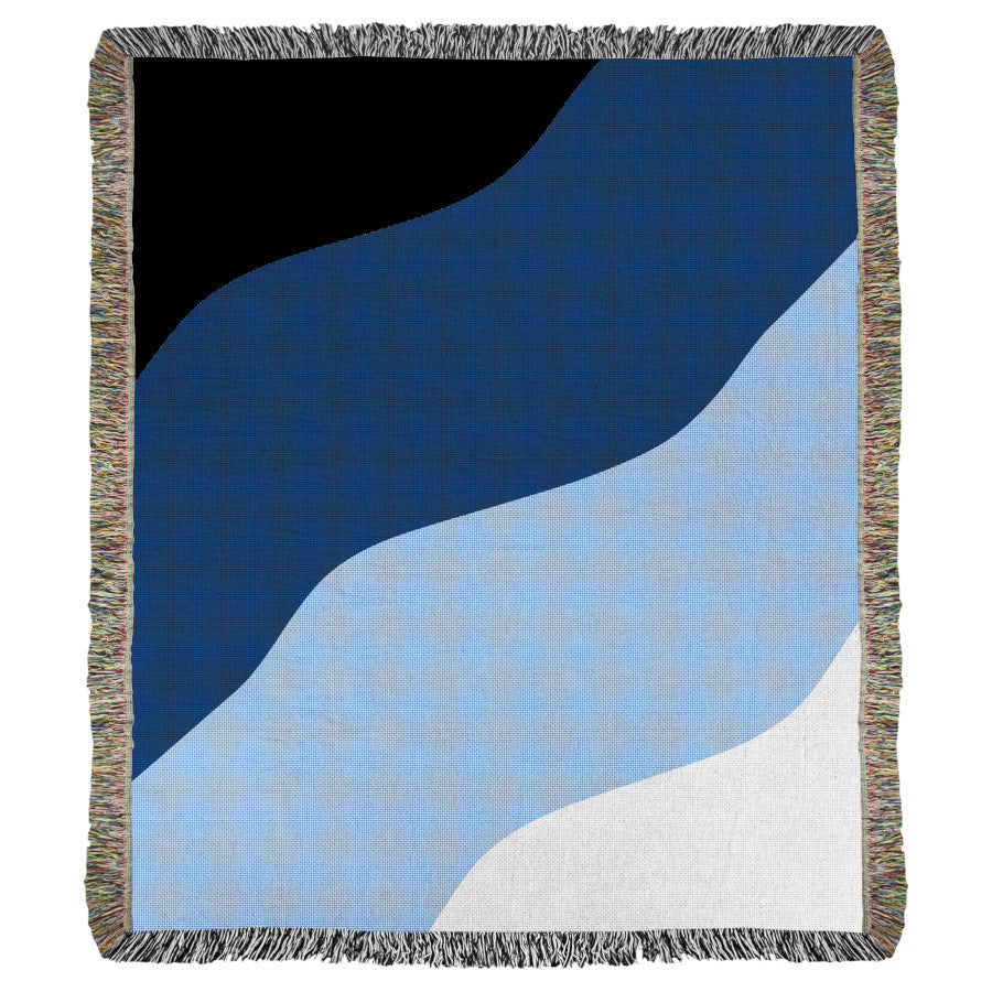 Product image of white, light blue, blue, and black woven throw blanket titled Shores.